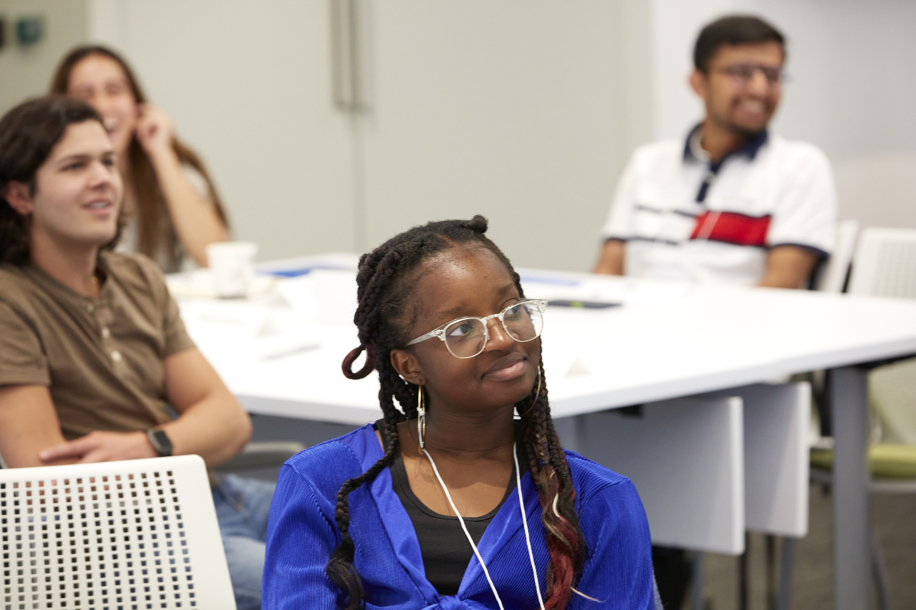 A fellowship attendee watches a session.